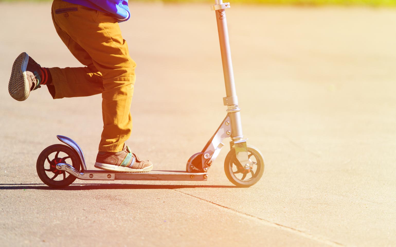 Child riding a scooter.