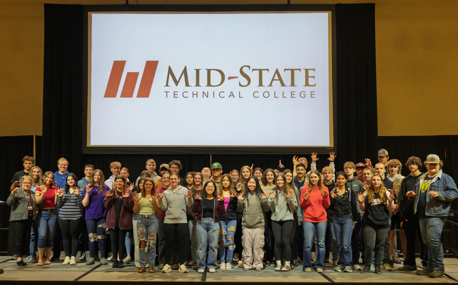 Admit Day attendees who have committed to attending Mid-State upon graduating from high school, on May 1 on the Wisconsin Rapids Campus with President Dr. Shelly Mondeik.