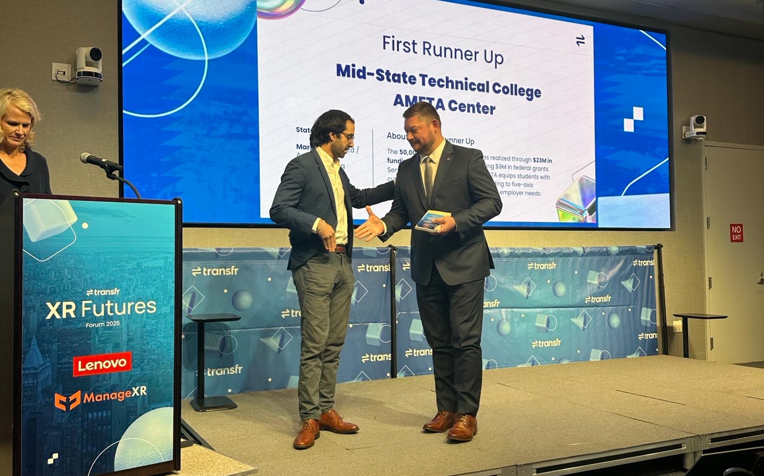 From left: John Iaia, Lenovo head of strategic alliances and ventures, presents Mid-State Technical College Dean of Applied Technology Ryan Kawski with the College’s runner-up award in Transfr’s Trailblazer Power of Partnership competition. The award was presented during Transfr’s XR Futures conference in New York City on Oct. 6.
